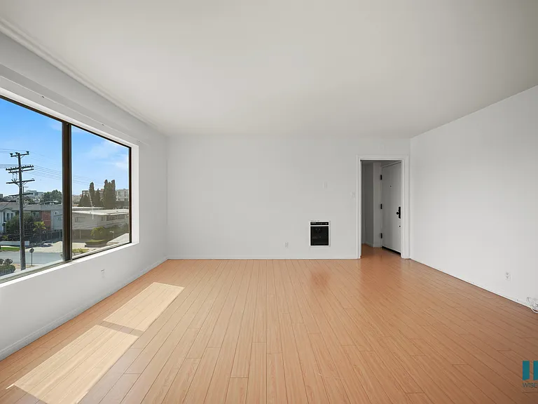 Living Room with Large-Size Windows and Vinyl Flooring