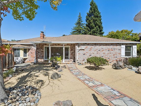 Landscaped front yard and covered porch welcomes you to this charming home.