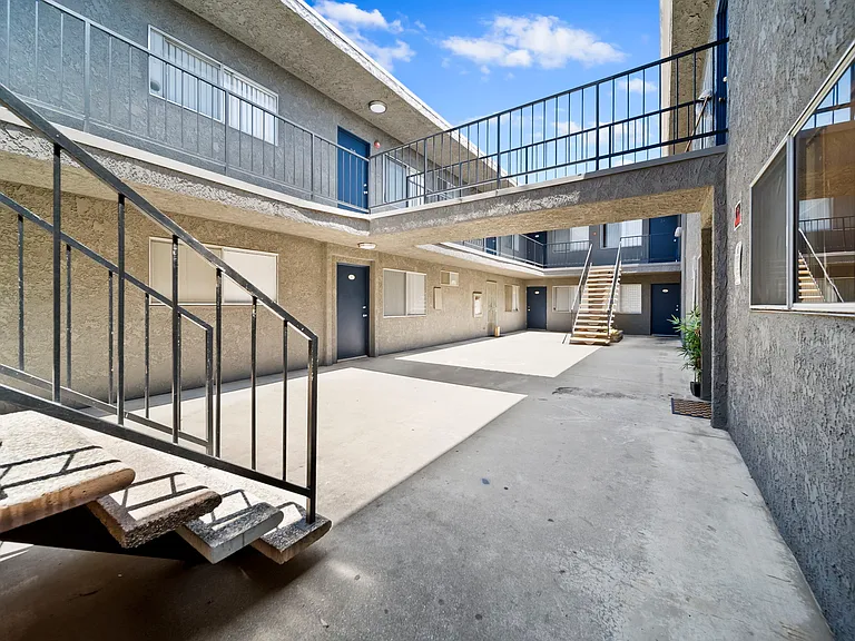 Bright, open courtyard with a clean layout and easy access throughout the community.