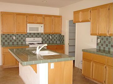 Kitchen with custom tile counters.