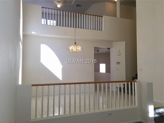 From LR, a view of DR and loft.  The vaulted ceiling and ample windows provide so much bright light. The entire home, including 