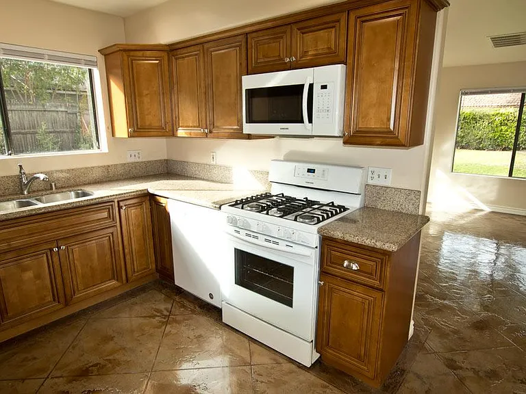 kitchen, living room and back yard out the windows.