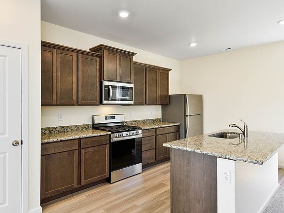 The chef ready kitchen comes with stainless steel appliances and granite countertops