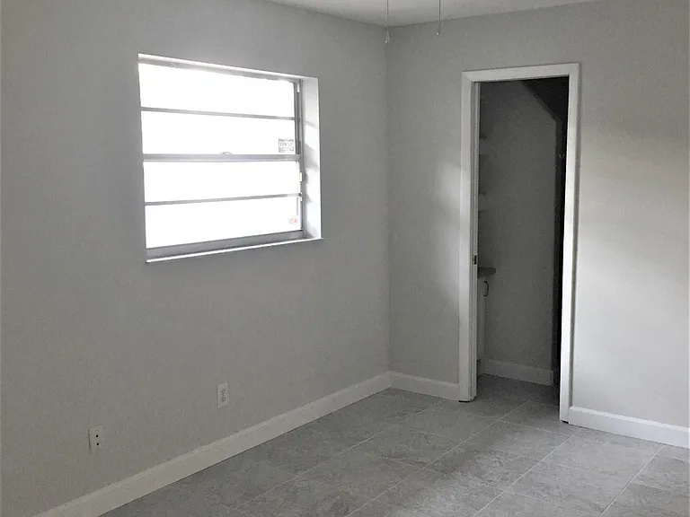 Master Bedroom, pocket door leading to bathroom.