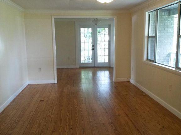 Living room (11' x 18') & looking into dining room (9' X 13')