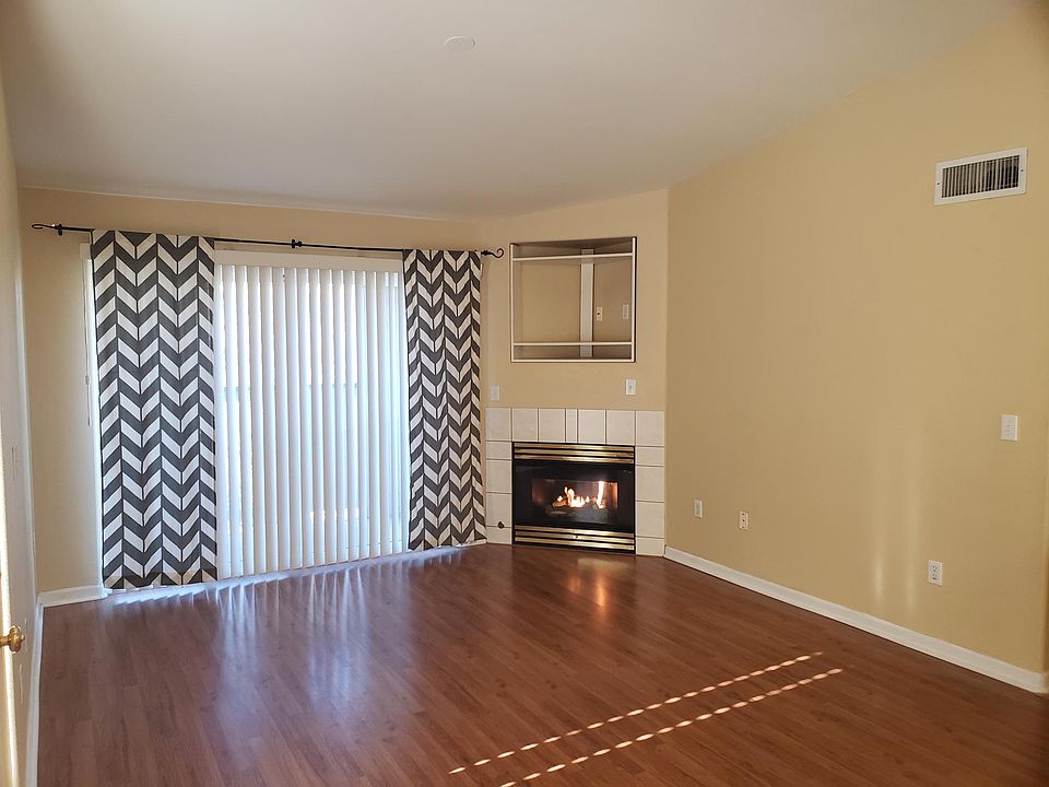 Living room with fireplace and deck/patio