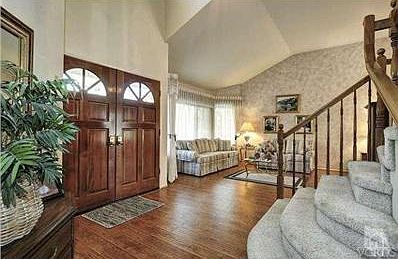 Accented with rich wood floors.