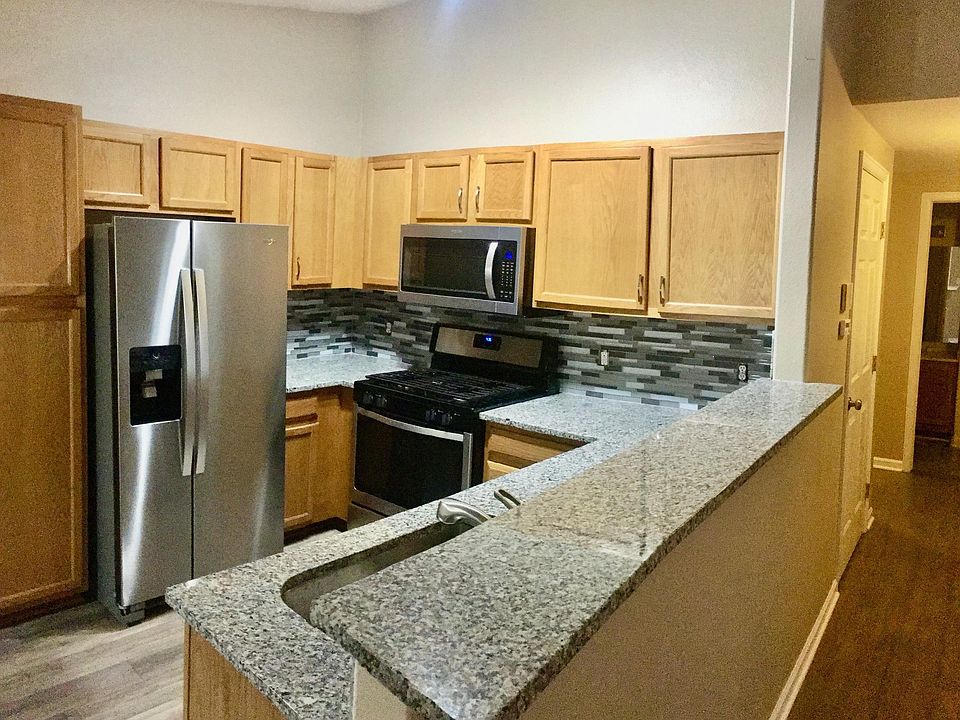 Newly remodeled Kitchen with granite and stainless steel appliances.
