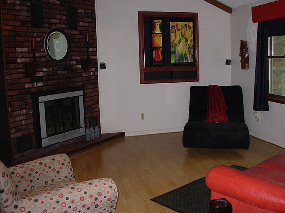 13'x16' Living room, wall hanging slides open to reveal 36" TV
