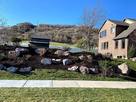 Big level yard on the mountain side of the house.