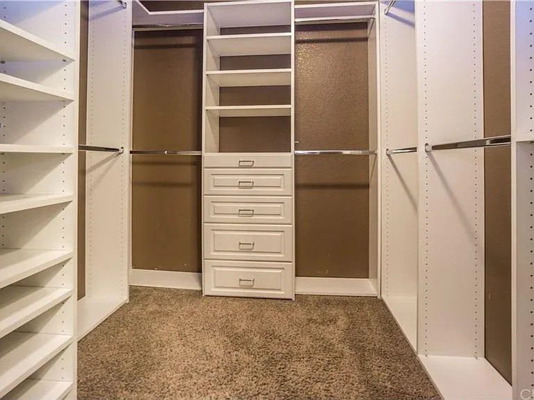 Master Bedroom walk-in closet with built in wardrobe