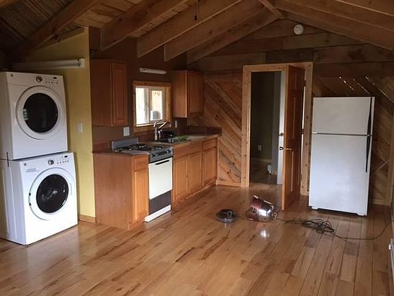 Kitchenette laundry and view toward bedrooms