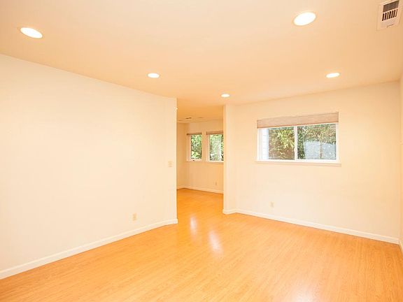 Living room overlooking mature trees
