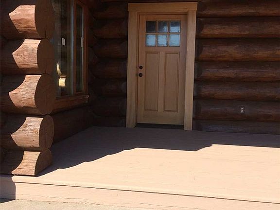 Over-sized deck leading to front door.