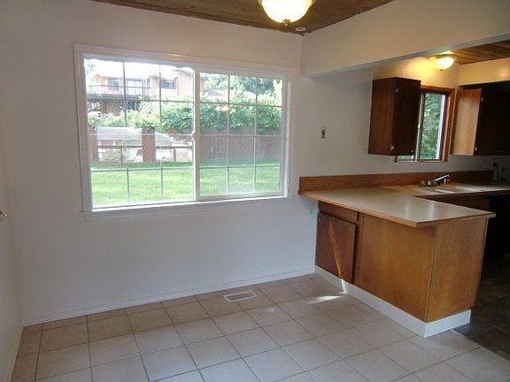 The dining area is updated with ceramic tile floors!