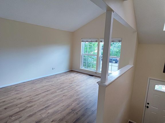 Living room, skylight, wood floors, bright and open layout
