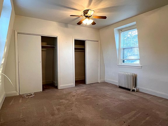 Primary bedroom with dual closets.