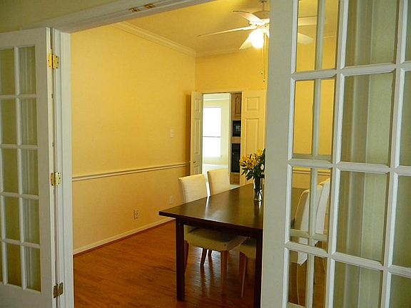 Dining offer crown molding and French doors