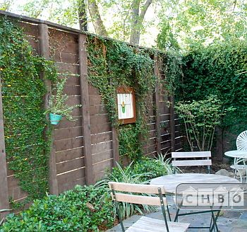 Patio oasis with water feature and gas hook-up for grilling.