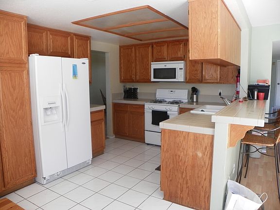 Kitchen with fridge and stov