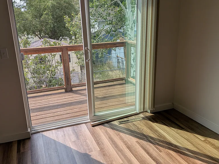 Living room with access to small deck