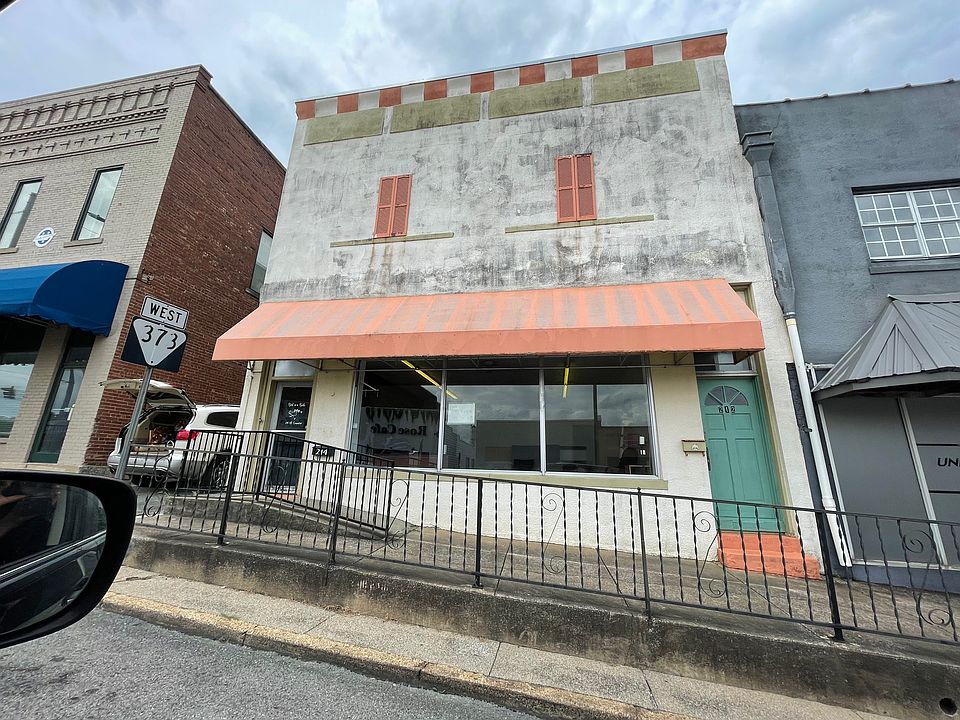 Front of the building. The entrance is the glass door to the left. Just off of the Lewisburg Square.