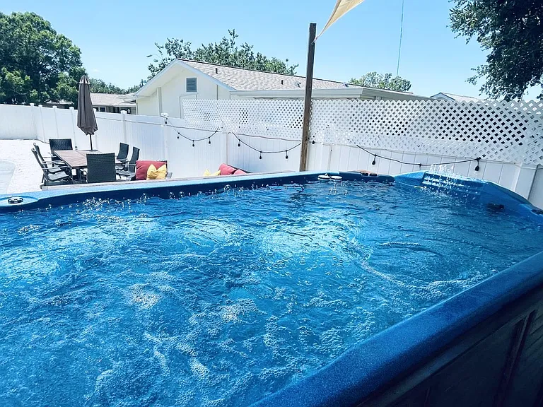 12000 gal swim spa jacuzzi with 2 powerful swim jets so you can swim again the current and 32 hydrotherapy jets for massage.