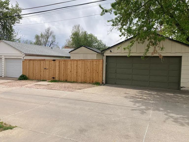 Alley parking alongside fence