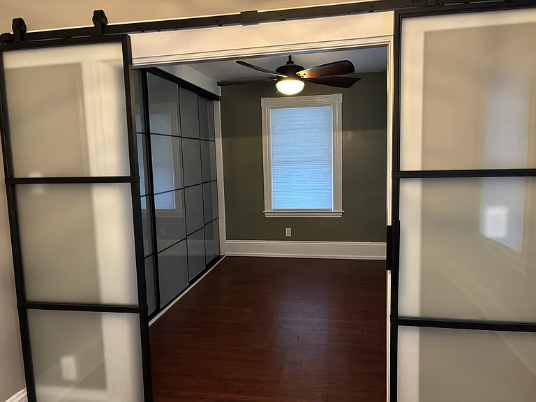 Master bedroom entry - glass barn doors