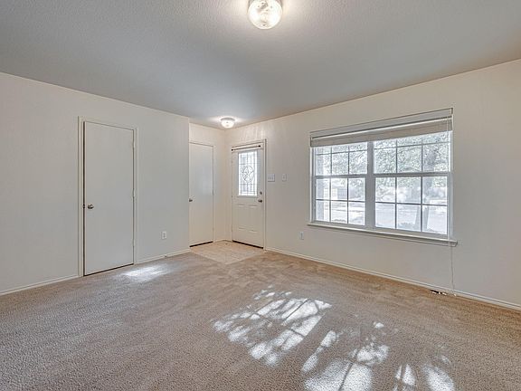 Entry way showing the garage and half bath doors