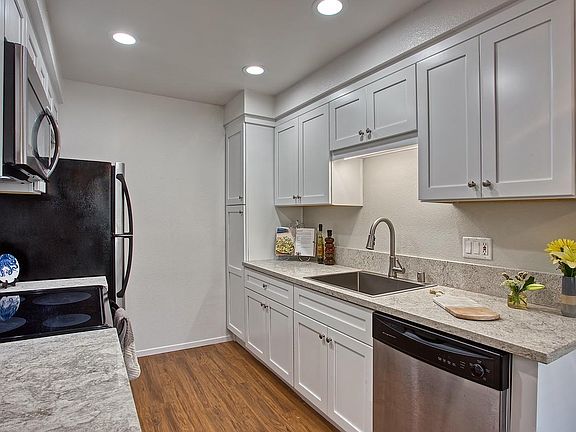 Upgraded kitchen with quartz counter tops and new cabinetry in two bedroom