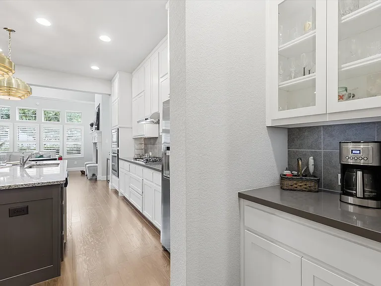 A dedicated built-in coffee bar and beverage station, perfectly positioned to streamline your morning routine or serve as a convenient hosting station for guests