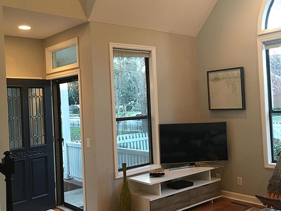 CURRENTLY UNFURNISHED...but, view Looking toward front door. There IS a TV mount on the wall in that front corner, however.