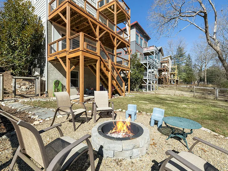 Peaceful backyard and view of multiple decks