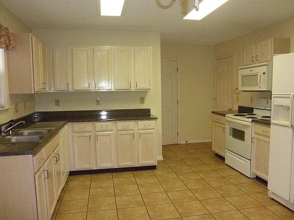 Spacious kitchen with appliances