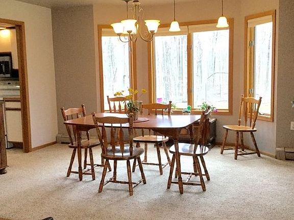 Formal dining area with lovely windows just off the kitchen - new carpeting, lighting and fresh pain