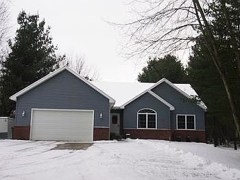 Larkin Township living!  This wonderful home, built in 2004, is loaded with features to love.  Master suite with walk-in closet and large private bath, finished lower level with two egress windows, main floor laundry, and a large deck for outdoor living with gas line already run for an outdoor grill. The deck was also painted this year with the new Behr Deckover coating!  Don't let the address fool you.  This home has lots of privacy and is set back in the woods!  Cozy up in front of the fireplace this winter.  The entire main floor was recarpeted this year. The oversized garage also has heat for the do-it-yourselfers!  Come see this one today!