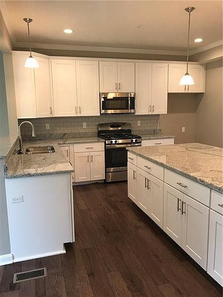 view of kitchen from sliding door to deck