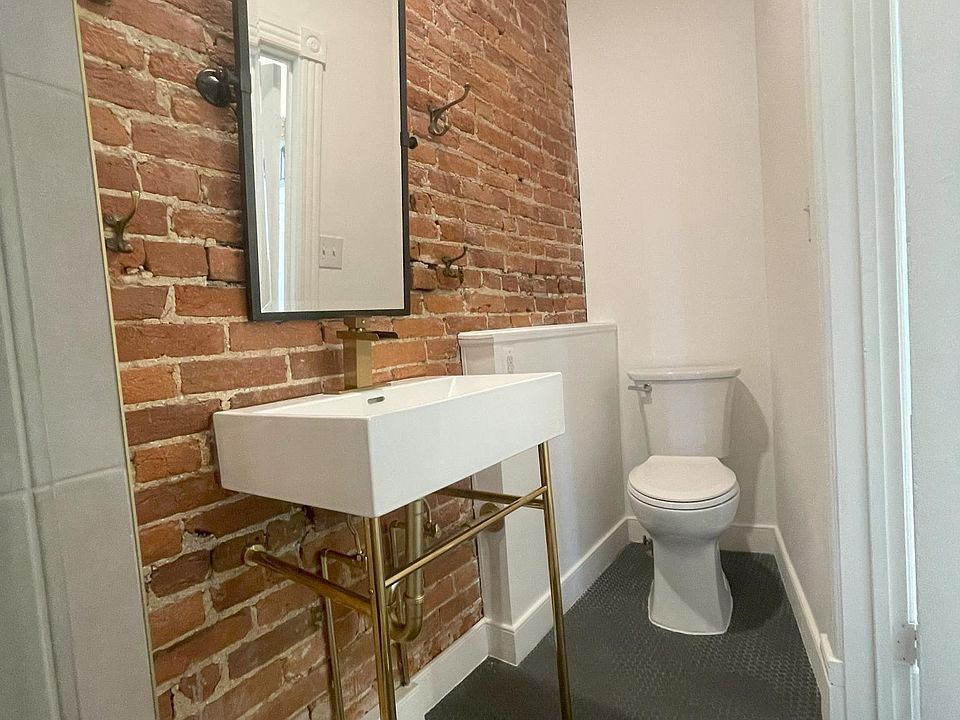 Renovated Bathroom with exposed brick
