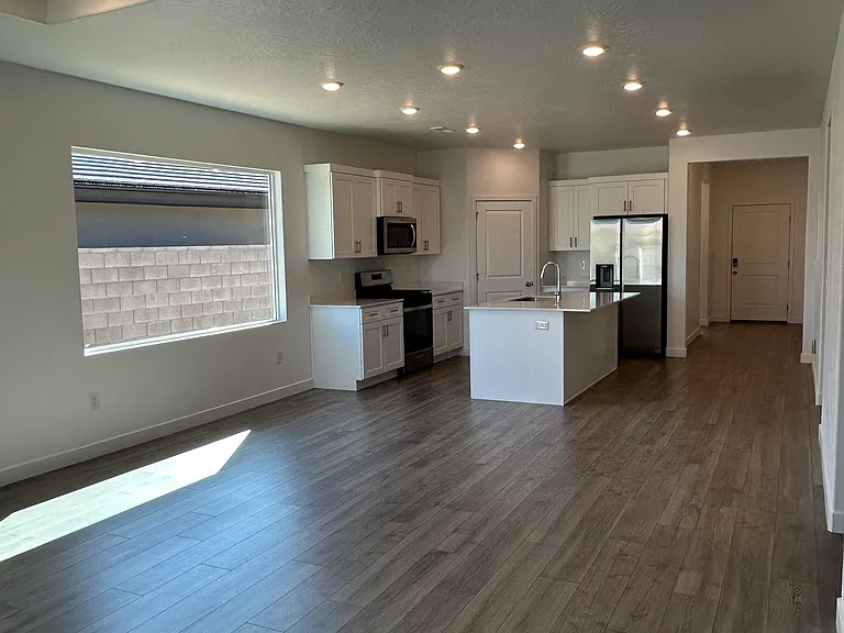 View of open living space from living room to the kitchen