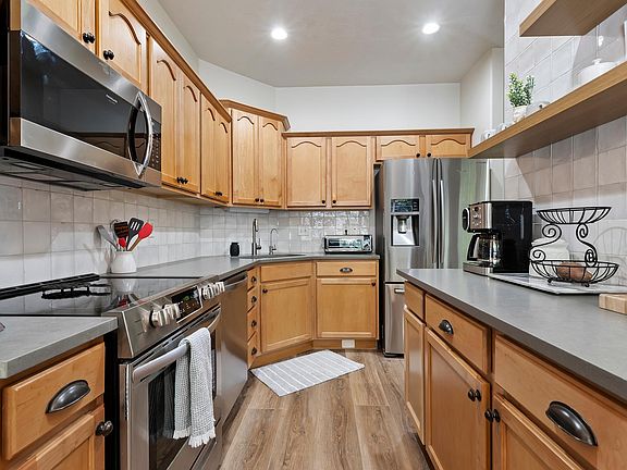 Large kitchen with Quartz countertops and stainless steel appliances
