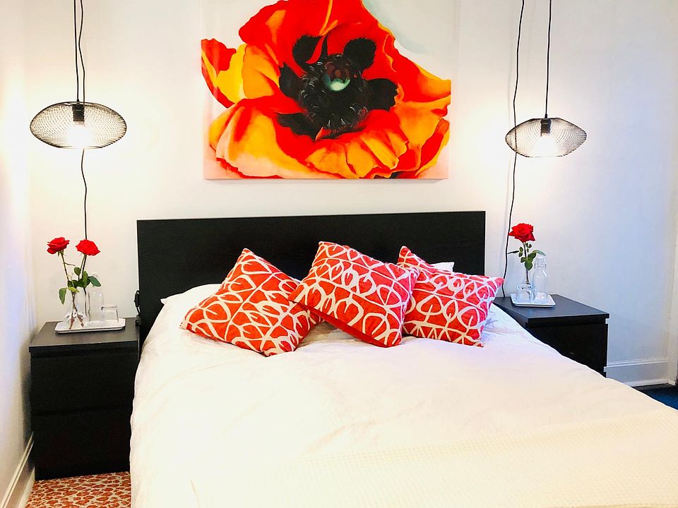 New queen bed and a Georgia O'Keefe poppy print make this the ultimate retreat