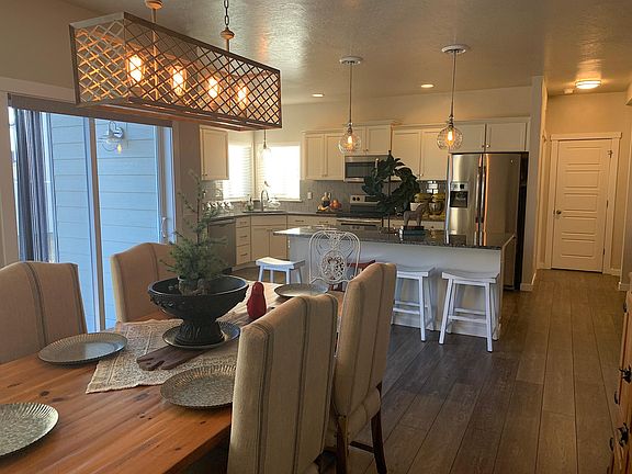 View from Spacious Eating Area to Granite Counters in Kitchen