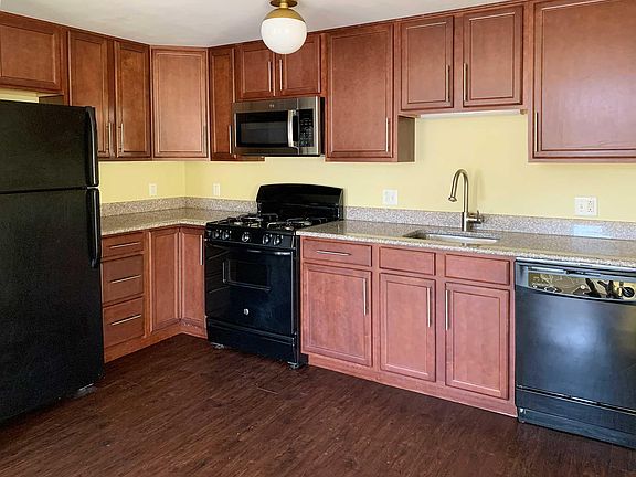 Kitchen with granite countertops and dishwasher