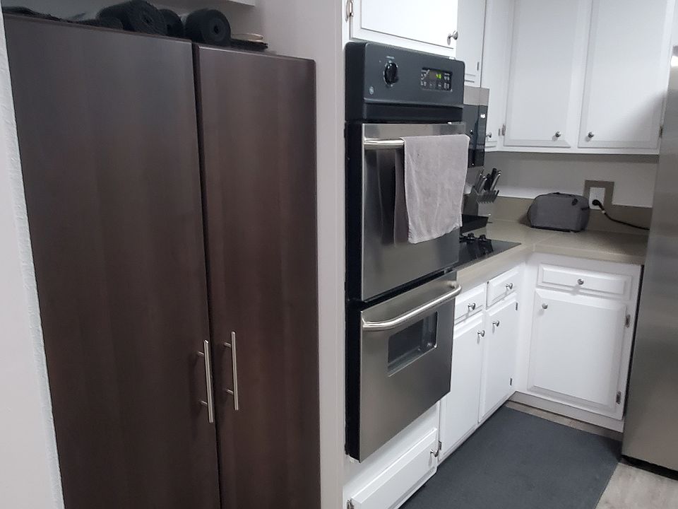 View from kitchen entryway showing double ovens