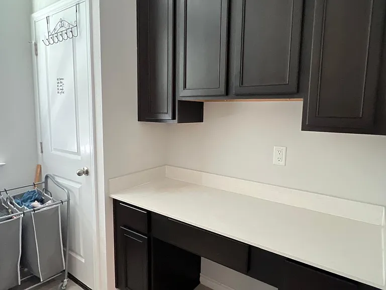 Laundary room has a Folding area with storage, this room is spacious with ample natural light!