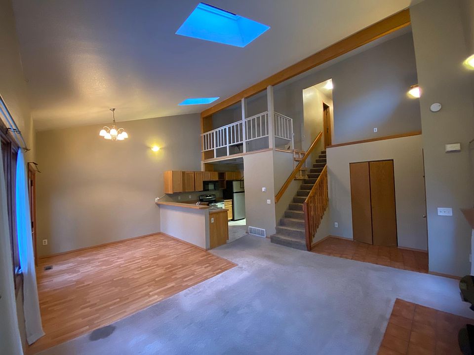 View from corner of the living room, looking toward the kitchen/dining room.