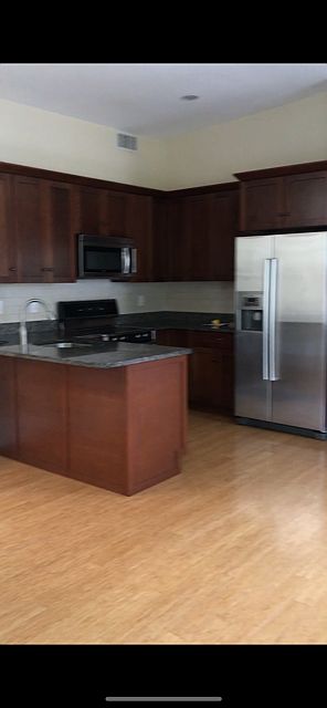 Stainless steel appliances, electric range.