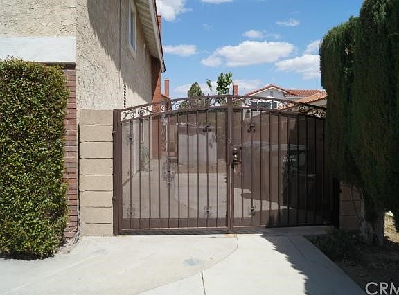 New iron gate- RV parking & access. A large storage shed is behind RV driveway