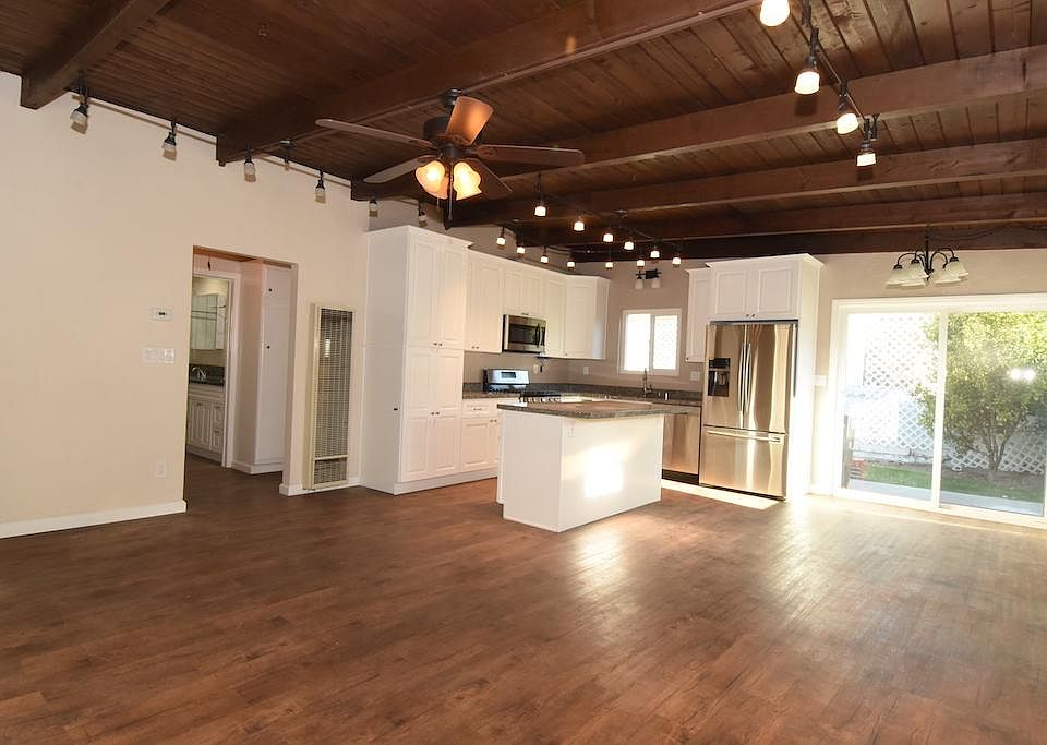 Open floor plan. Kitchen, dining room, living room. Hallway access to bedrooms 1&2, and to hallway bathroom with laundry facilities.